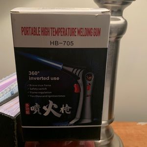 Portable, high temperature, welding gun